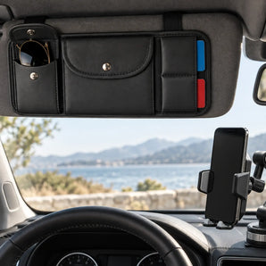 Passive car accessories including a phone mount and sun visor organizer in a clean vehicle interior.