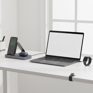 Modern desk setup with charging stand, USB-C charger, charging hub, cable clips, and desk organizer.