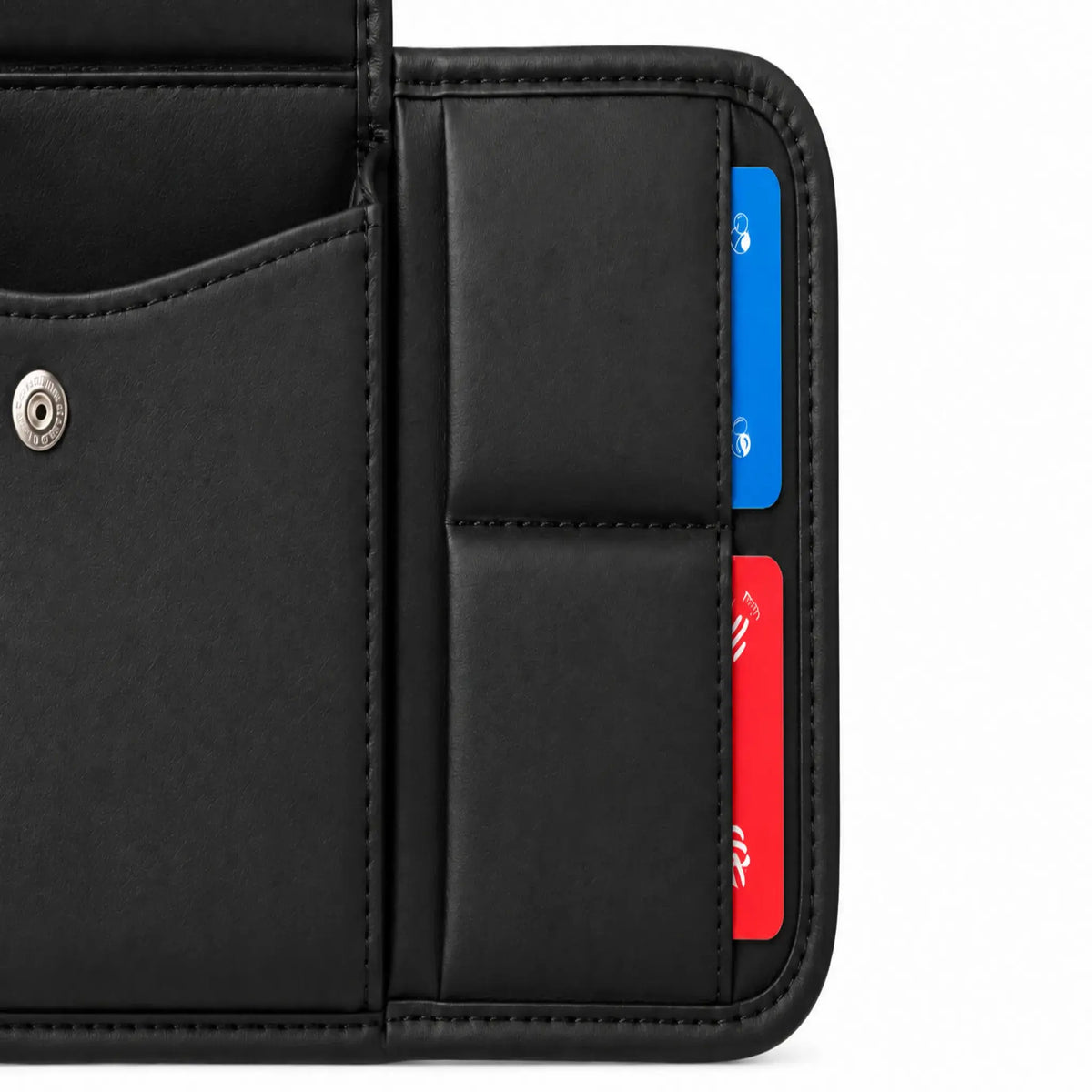 Close-up of two stacked horizontal card sleeves on black sun visor organizer with red and blue cards