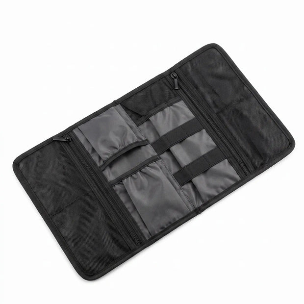 Roll-Up Cable Organizer Wrap opened flat showing interior pockets and elastic storage sections
