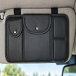 Black faux-leather organizer mounted horizontally on a grey vehicle sun visor