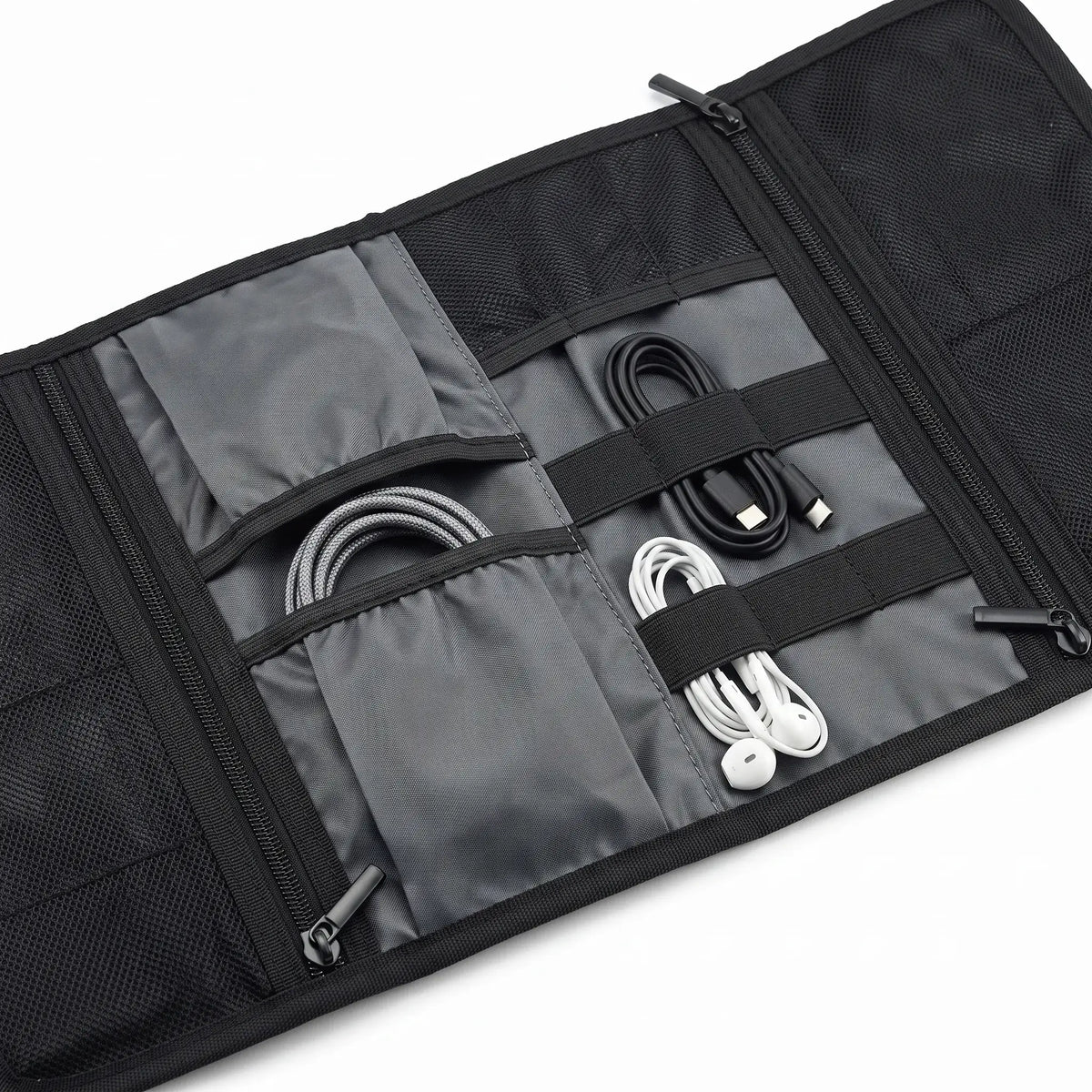 Close-up of elastic holders and storage compartments inside the Roll-Up Cable Organizer Wrap