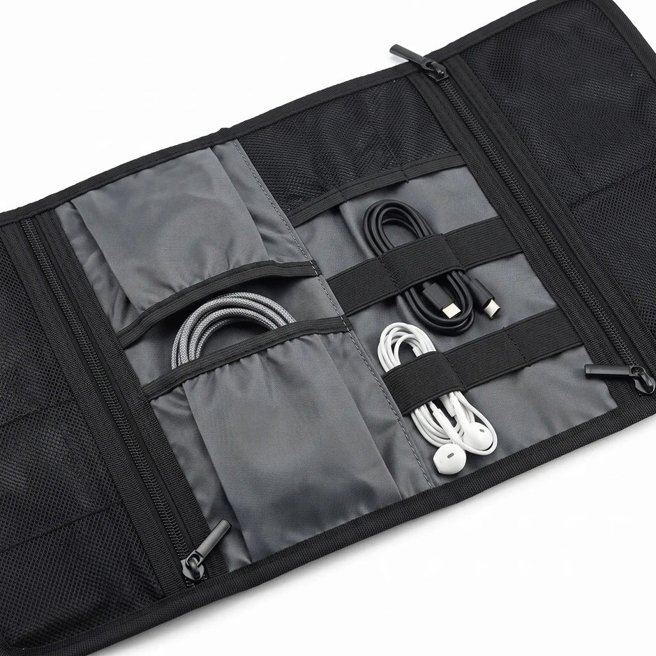 Close-up of elastic holders and storage compartments inside the Roll-Up Cable Organizer Wrap