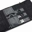 Close-up of elastic holders and storage compartments inside the Roll-Up Cable Organizer Wrap