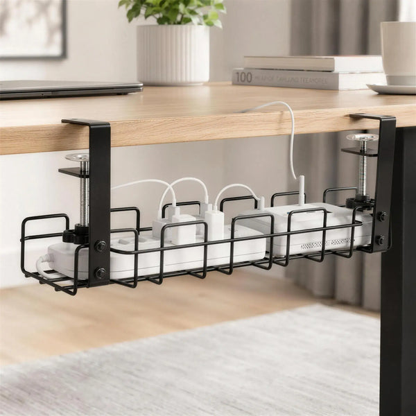 Under-desk tray organizing a power strip, charging adapters, and cables within easy reach.