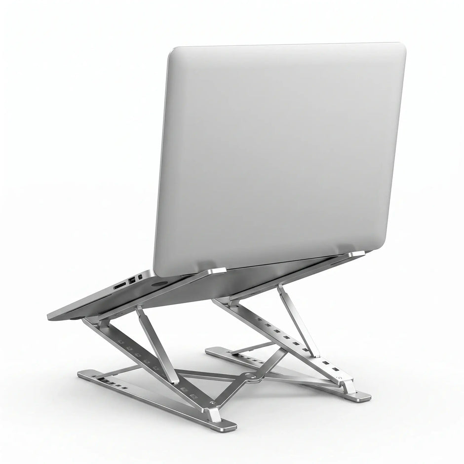 Laptop supported at an elevated angle on a foldable aluminum laptop stand.
