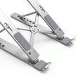 Close-up of silicone pads, retaining hooks, hinges, and aluminum construction on laptop stand.